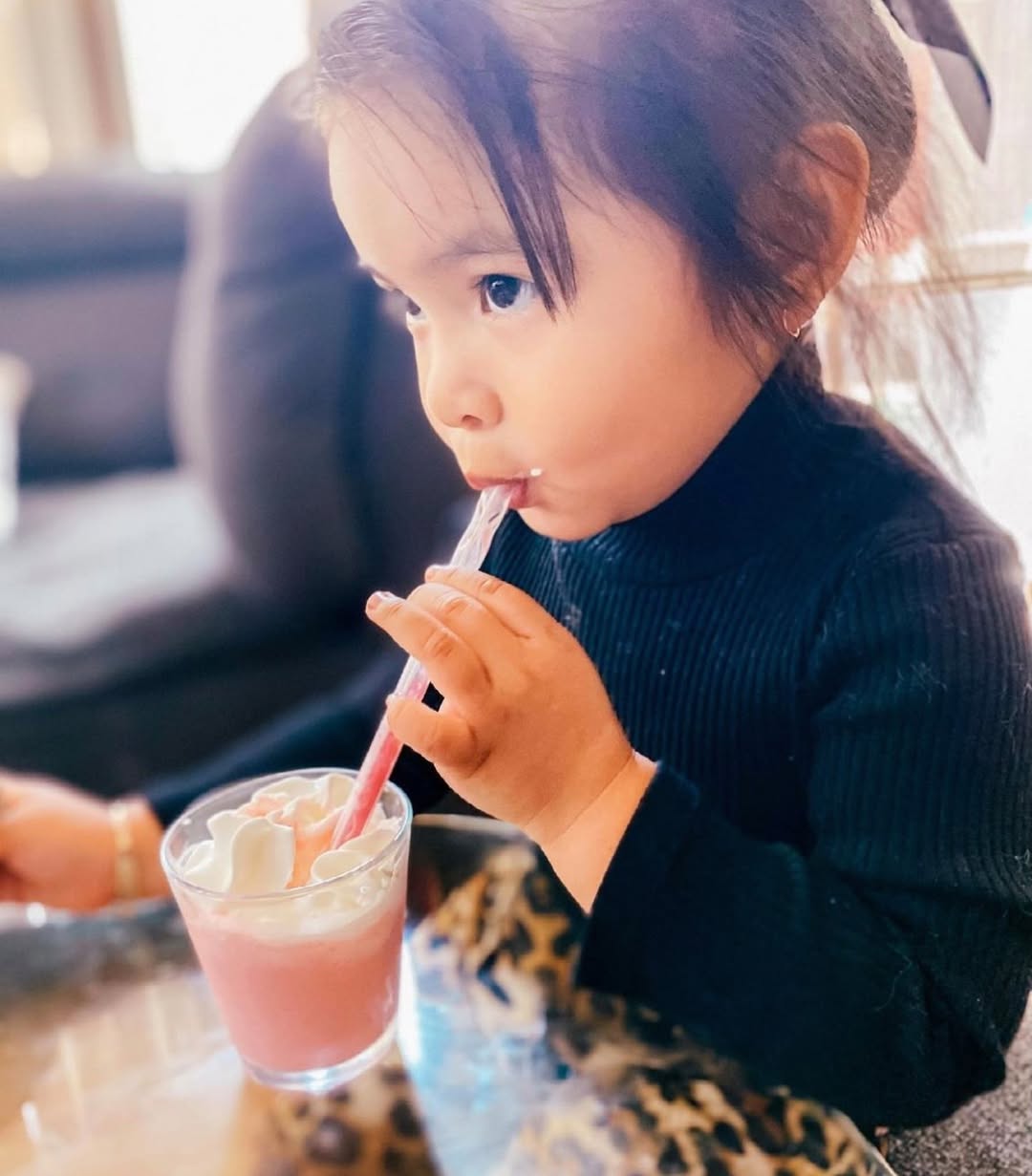 Kids enjoying milk with Magic Straws at breakfast table